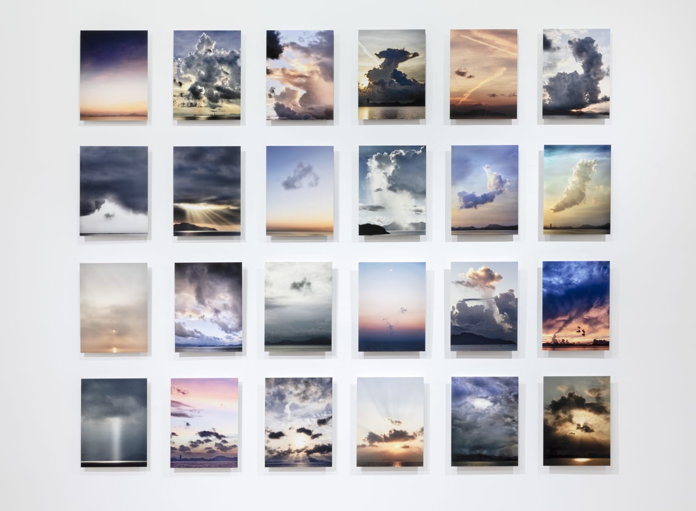 Michael Wolf (1954 - 2019) Cheung Chau Sunrises, 2018 Archival inkjet prints, grid of 24 35 x 25 cm each...