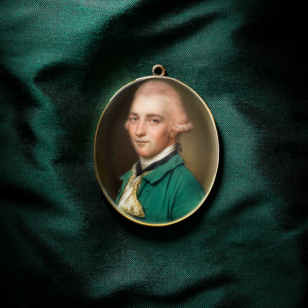 a gentleman in a green jacket with a cravat by portrait miniaturist john smart previously with philip mould and company this was painted by john smart in the 18th century