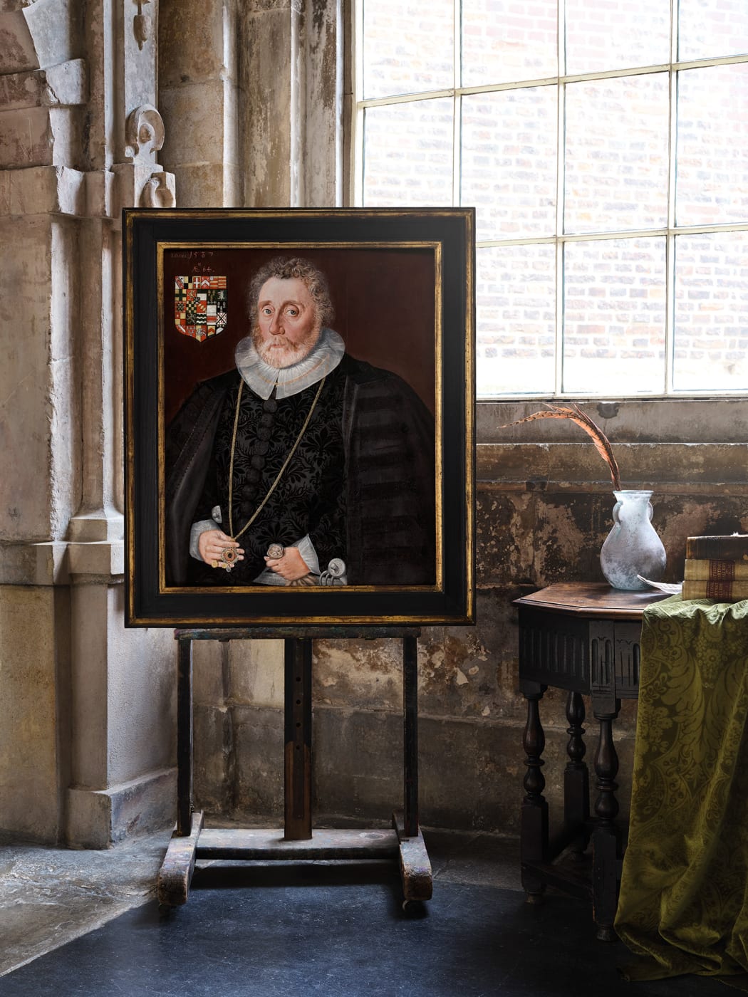 16th century tudor portrait of a gentleman on an easel in room at charter house