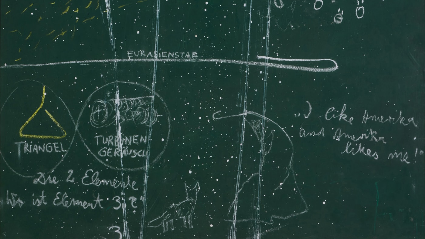 The blackboard also gestures to Beuys’s well-known 1974 performance, I Like America and America Likes Me, which took place in...