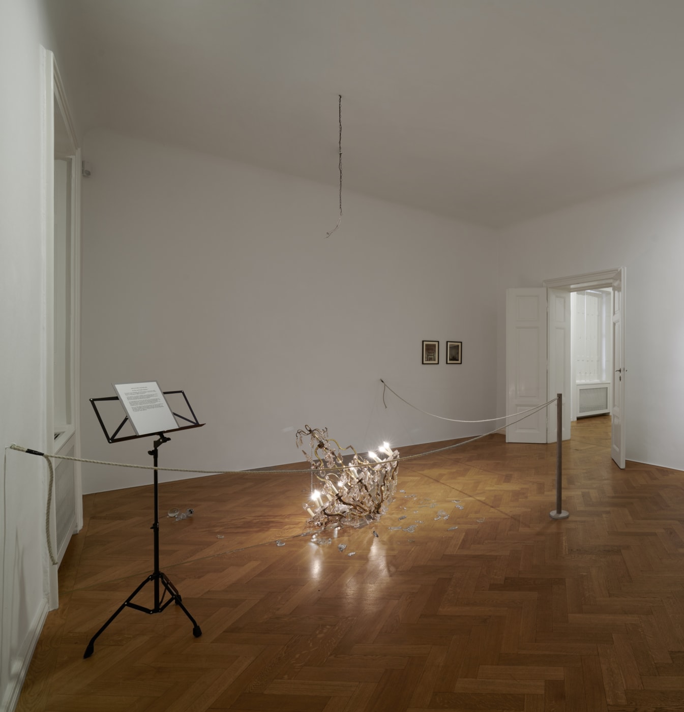 The installation The Fallen Chandelier (1997) is two-fold, appearing both as the physical presentation of an ornate chandelier on the...