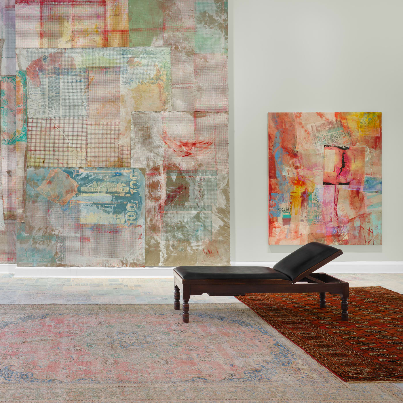Juxtaposing her paintings with antique examination couches and Persian rugs against a wall painted in eau de Nil – a...