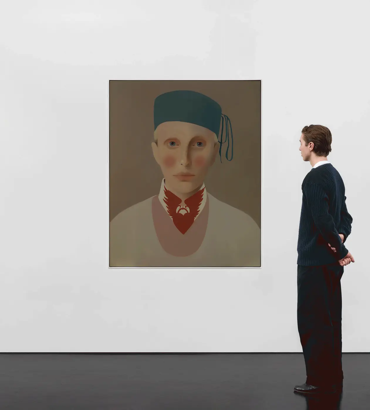 ’Jerome’ depicts a friend of the family. Closely cropped against a monochromatic background, the subject’s adorned collar and ribboned cap...