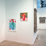 View of AFIKARIS booth at Art Brussels showing works by Omar Mahfoudi and Ozioma Onuzulike
