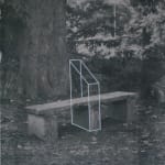 A monochromatic artwork depicting a photograph of a bench in a park separated by a geometrical structure screen printed in the middle of it