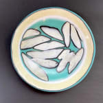fused glass bowl in pale yellow and blue made to look like ice shards