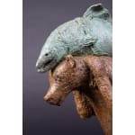 A bear named Sisyphus cute and adorable animal contemporary bronze bear sculpture carrying a fish sophie verger