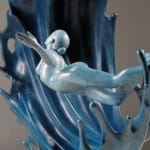 mighty waves contemporary bronze sculpture Liang Binbin Chinese artist blue sea sculpture a beautiful girl swimming or surfing in a big wave sculpture art