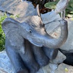 cute happy elephant in garden with bird contemporary bronze sculpture garden interior design sophie verger art gallery brussels