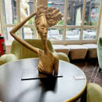 windy woman sculpture Hedwige Leroux contemporary sculpture bronze sculpture woman with hair blowing into the wind interior design at hotel Barsey by Warwick Art Yi gallery Brussels art gallery