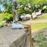 Stand by me woman sculpture Hedwige Leroux contemporary art contemporary sculpture interior design a sculpture of lying young city girl in jean and listen to music a sitting girl listen to music with her earphones Art Yi gallery Brussels art gallery