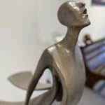 Promise Isabel Miramontes garden sculpture contemporary scupture of woman sculpture sea sculpture wind sculpture a woman in a dress or a mother against seawind giving a promise to her child full of freedom and love Art Yi gallery Brussels art gallery