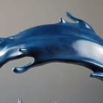 mighty waves contemporary bronze sculpture Liang Binbin Chinese artist blue sea sculpture a beautiful girl swimming or surfing in a big wave sculpture art