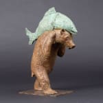 A bear named Sisyphus cute and adorable animal contemporary bronze bear sculpture carrying a fish sophie verger