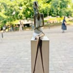 Stand by me woman sculpture Hedwige Leroux contemporary art contemporary sculpture interior design a sculpture of lying young city girl in jean and listen to music a sitting girl listen to music with her earphones Art Yi gallery Brussels art gallery