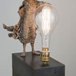 Visionary lieven d'haese contemporary bronze sculpture of a boy turn a light bulb on with his imagination and his inspiration a sculpture art of dream Art Yi art gallery in brussels