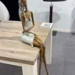 Stand by me woman sculpture Hedwige Leroux contemporary art contemporary sculpture interior design a sculpture of lying young city girl in jean and listen to music a sitting girl listen to music with her earphones Art Yi gallery Brussels art gallery