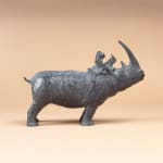 Rhinoceros playing with little girl cute animal and child contemporary bronze sculpture sophie verger