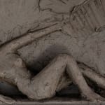 Sculptor Emilio DiIorio's series of 9 Greek Muses in black clay. Ceramic figurative relief is 2nd of 9.