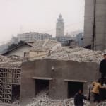 It is a video still from Farewell Poem 2002 that reveals a ruined construction site in Wanxian, Chongqing.