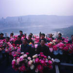 A group of Bang Bang men respectively hold the vases of flowers.