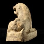 Assyrian Terracotta Sculpture of a Recumbent Lion, 900 BCE - 700 BCE