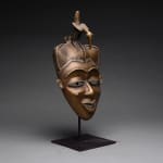 Baule Brass Face Mask Surmounted by a Bird, 20th Century CE