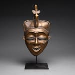 Baule Brass Face Mask Surmounted by a Bird, 20th Century CE