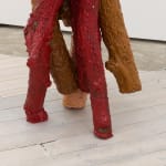 Detail of red and brown wood logs sculpture by Andrew Sabin