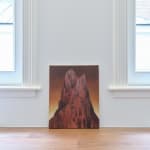 Painting titled “The Kiss of Venus” (2022) by Silvia Giordani. The artwork depicts two towering red rock formations with soft, textured surfaces, set against a warm gradient background transitioning from gold to deep brown. Acrylic and oil on canvas. © Buysse Gallery.