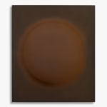 Anodised aluminium work in brown tones by Damien Bénéteau, featuring a central circular form that gently emerges from the metallic surface. Titled Relief E, 2025.