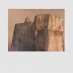Painting titled “Split” (2022) by Silvia Giordani. The artwork features a monumental rock formation with contrasting tones of weathered gray and warm ochre, set against a soft gradient background transitioning from beige to muted pink. Acrylic and oil on canvas. © Buysse Gallery.
