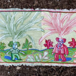embroidery showing green and red man and woman with plants seeming to grow from their heads