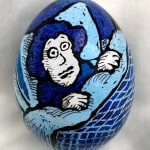 dyed egg showing woman in blue bed