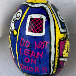dyed egg showing subway door, reading Do Not Lean on Doors