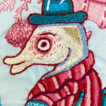 embroidery primarily red and blue, depicting a family of seahorses -- father's head
