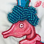 embroidery primarily red and blue, depicting a family of seahorses -- mother's head