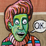 detail of embroidery showing man with green face and speech bubble saying "ok"