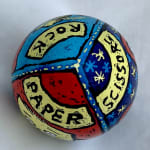 pysanky egg showing top of egg with works "rock, paper, scissors"