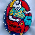dyed egg showing man in red chair