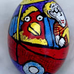 Pysanky egg showing bird and man in a car