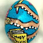 dyed egg showing octopus tentacles holding Moby Dick book