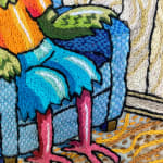 embroidery showing a bird sitting in an armchair looking at a bird out the window, focused on his feet
