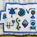 detail of embroidery showing rectangle with multiple symbols