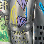 Detail photo of “Two Tone Kaws”, mixed media work by Jisbar artist from France, based in Portugal. Available at Carousel Fine Art Chicago. The artist’s hyper-saturated works blend Pop art with cultural references from fashion, music, and street art. He is known for his colorful, cryptic reinterpretations of iconic art history figures in mixed media on canvas. Colors of this work : Blue, Green, Red, Pink, Yellow, Purple, Black, Orange, Grey, White
