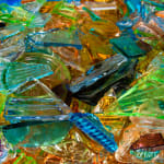 “I Have A Little Crush”, sculpture by Sandra Sashou. Sculpture is made from reassembled broken pieces of glass that are Art Deco Vanity Sets. The multicolor glass appears almost as sea glass with vibrant colors of green, lime green, turquoise, orange, cerulean and light rosy pink. Available at Carousel Fine Art Miami.