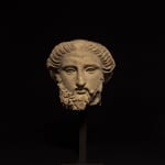 SOUTH ITALIAN GREEK, Fragmentary Head of a Bearded God, South Italian Greek, c. 4th century BC