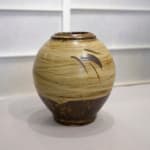 Shimaoka Tatsuzo 島岡達三, Amber glazed water jar on rope impressed inlay