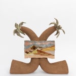 Ceramic stoneware sculpture of two plam trees in sideways U shapes that meet in the middle. In the center they hold a small canvas with a muted but colorful desert scene on it.