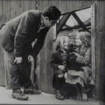 Daniel Farson, Brendan Behan looking at two children, 1952
